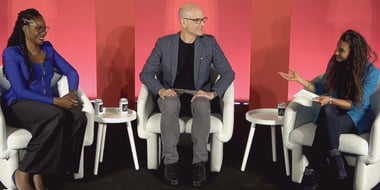 three panelists sitting during a session at advertising week