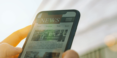 smart phone with news app open